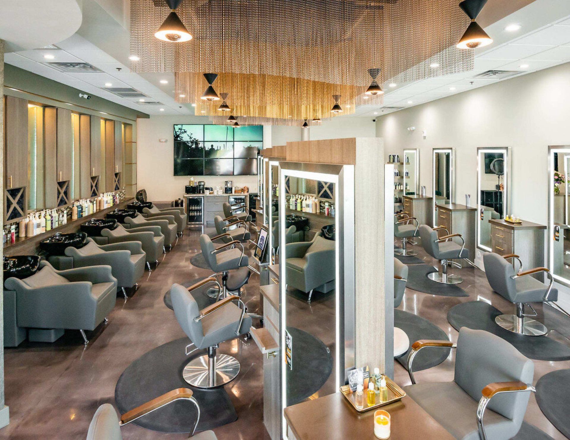 Modern Scottsdale salon floor with styling stations and shampoo bowls