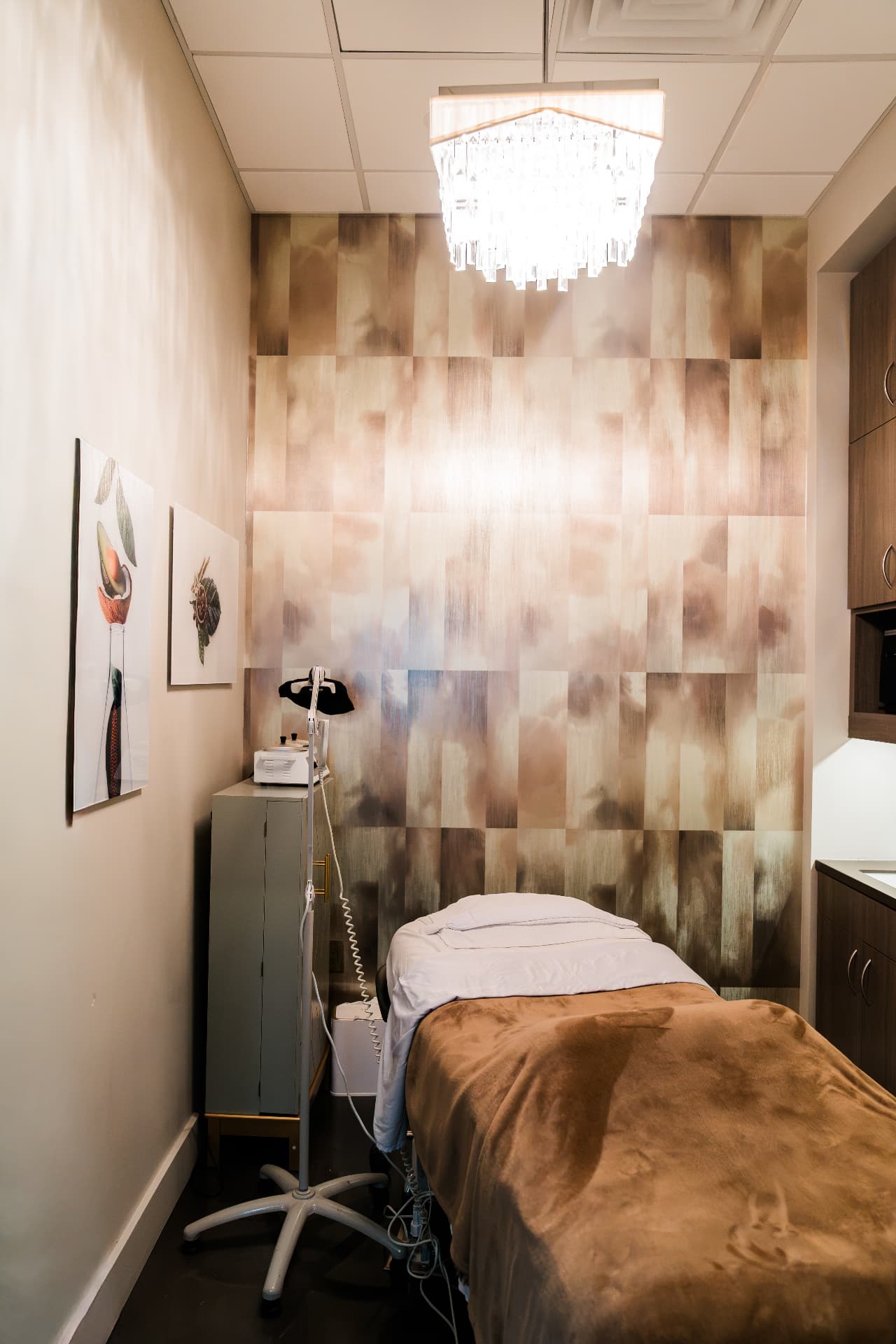 Treatment room with chandelier and massage table in Scottsdale