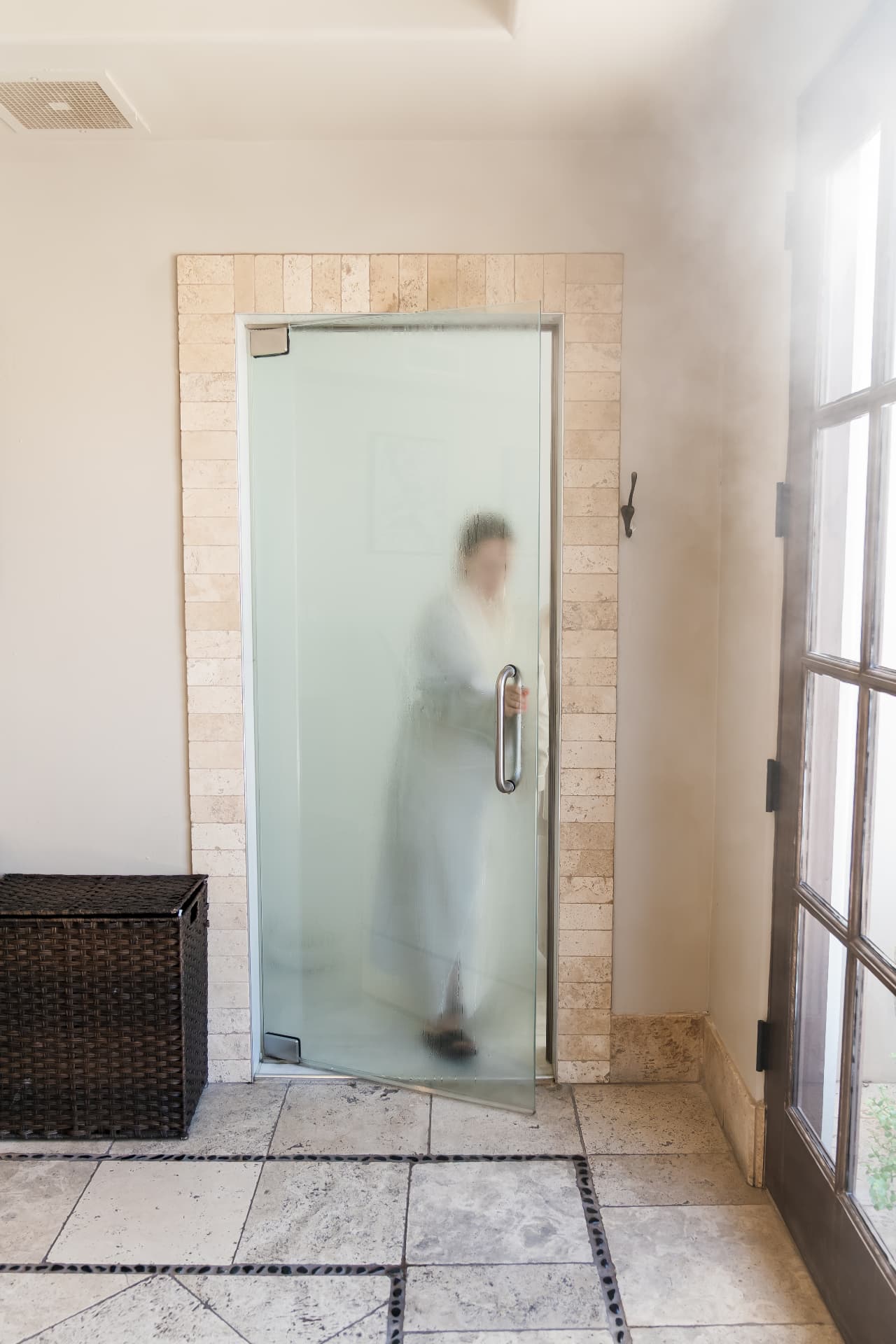 Steam room with warm stone tiles