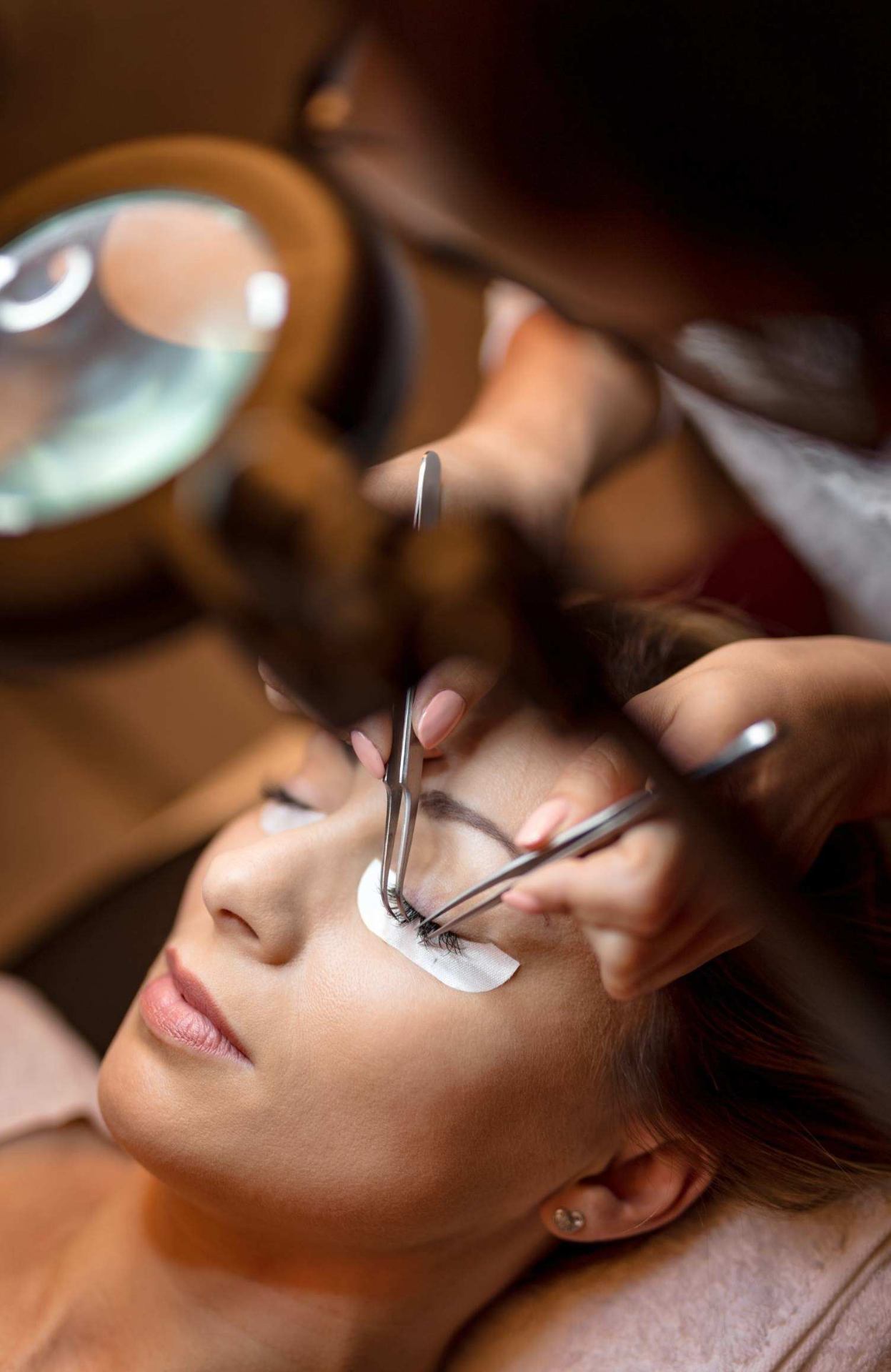 Aesthetician applying lash extensions
